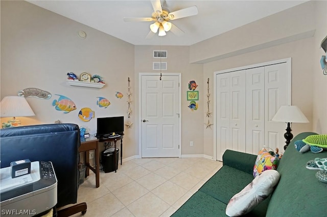 home office with ceiling fan and light tile patterned flooring