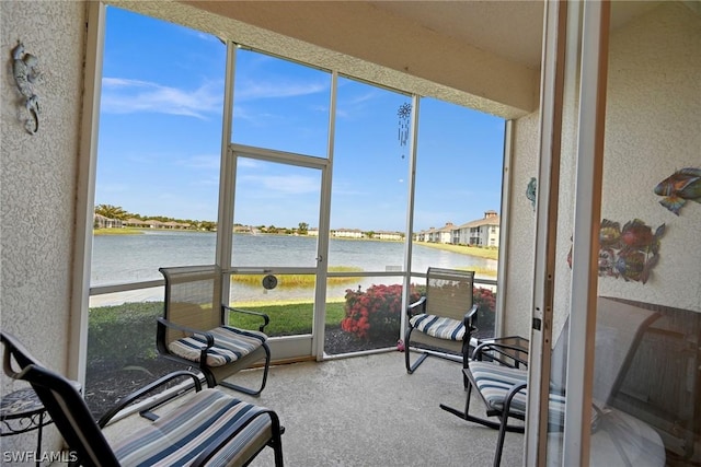 sunroom with a water view