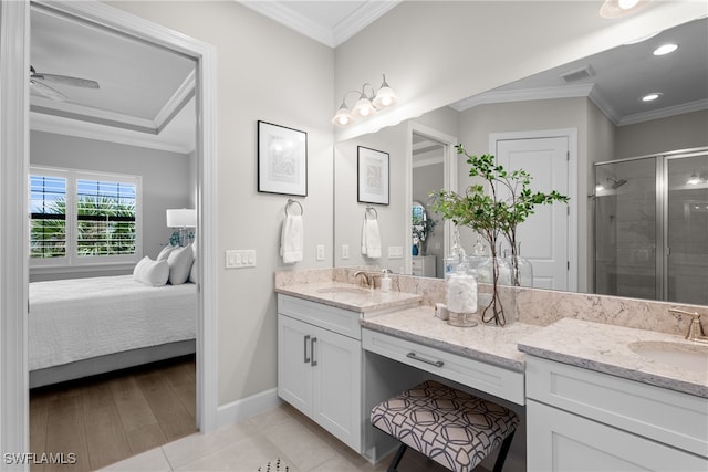 bathroom with vanity, ornamental molding, wood-type flooring, and walk in shower