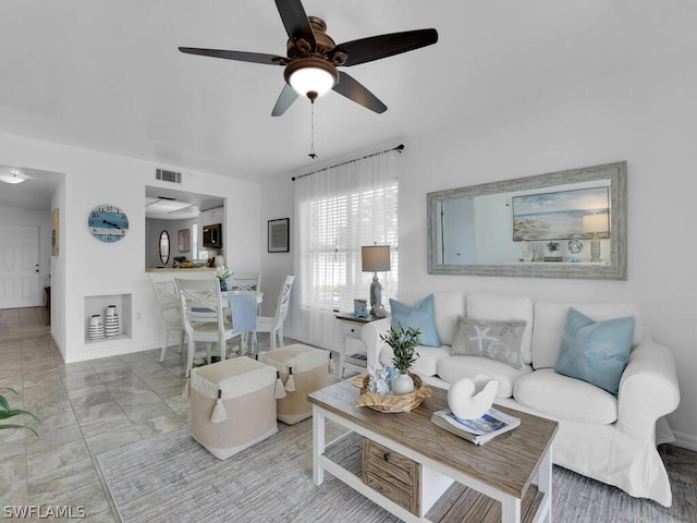 living room with ceiling fan