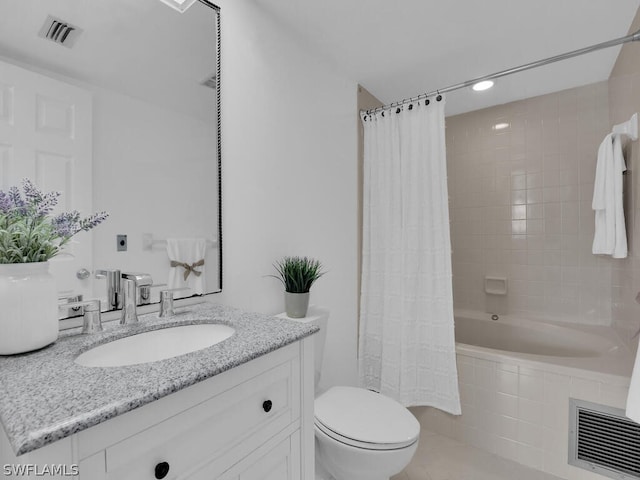 full bathroom with shower / tub combo, vanity, toilet, and tile patterned floors