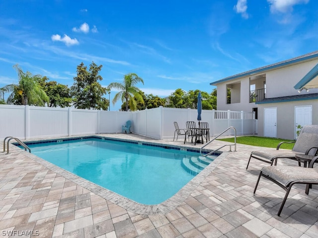 view of pool featuring a patio area