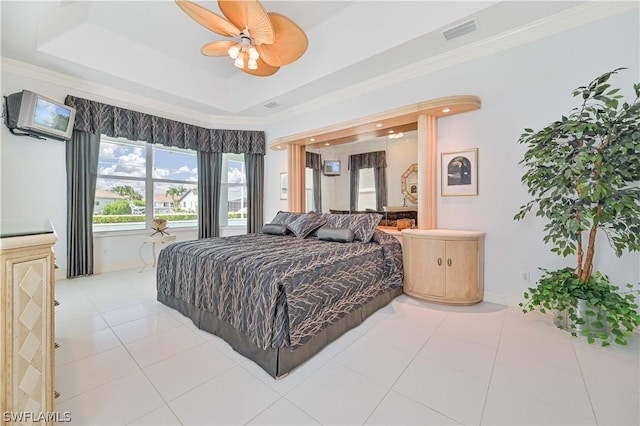 bedroom featuring ornamental molding, tile patterned flooring, a raised ceiling, and visible vents