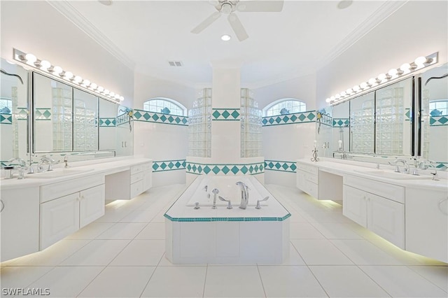 bathroom with ornamental molding, a sink, and tile patterned floors