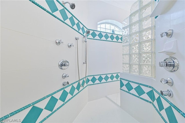 bathroom with tiled shower