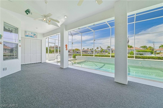 outdoor pool featuring a ceiling fan