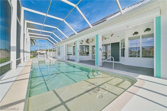 pool featuring a patio area, glass enclosure, and french doors