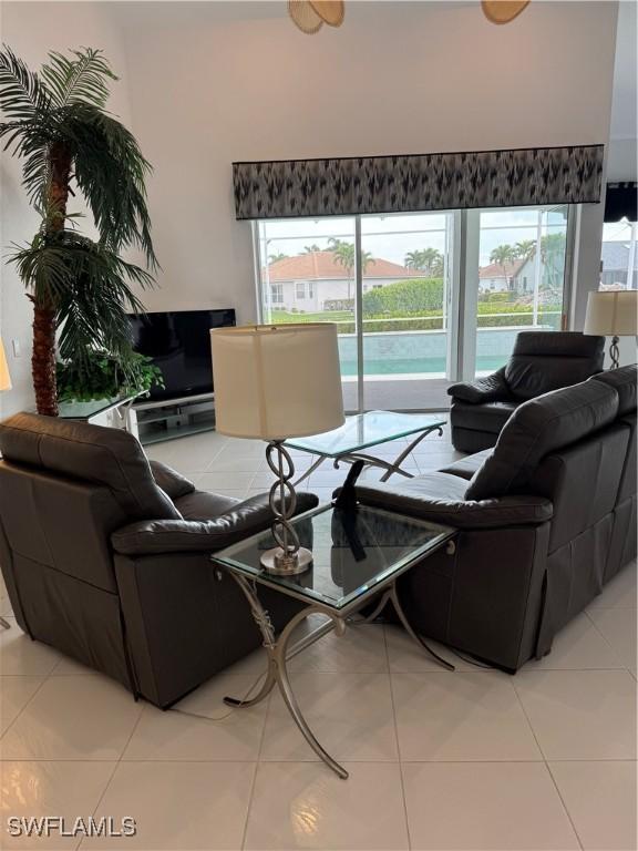 living area featuring light tile patterned flooring