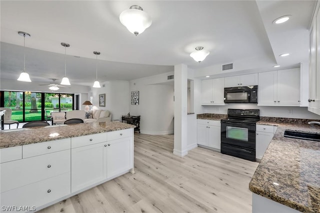 kitchen with sink, white cabinetry, ceiling fan, and black appliances