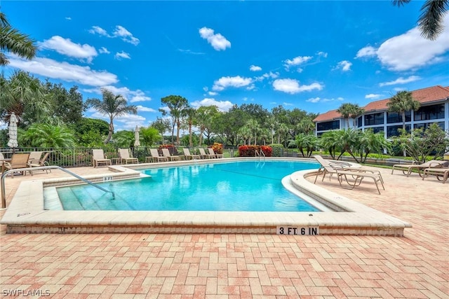 view of swimming pool featuring a patio