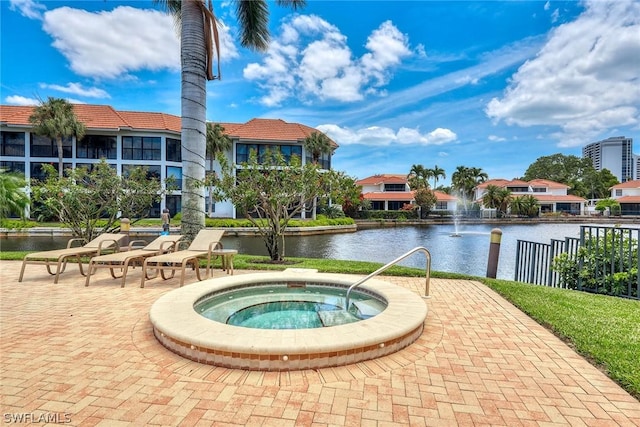 view of pool featuring a water view