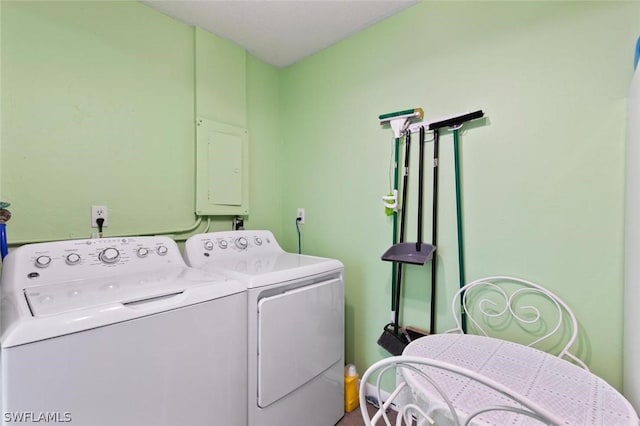 laundry area featuring electric panel and separate washer and dryer