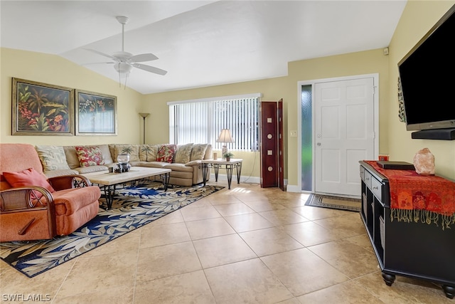 tiled living room featuring lofted ceiling and ceiling fan