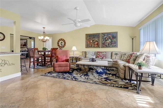 tiled living room with a wealth of natural light, vaulted ceiling, and ceiling fan with notable chandelier