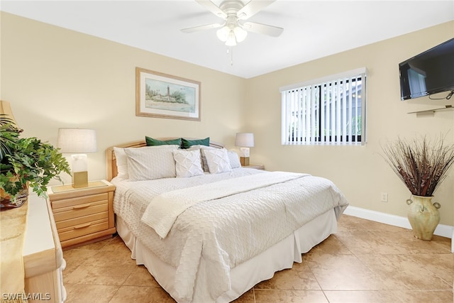 bedroom featuring ceiling fan and light tile floors