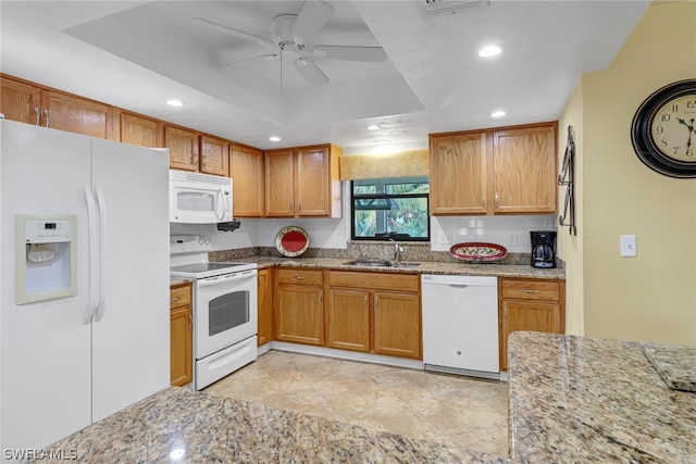 kitchen with ceiling fan, white appliances, a raised ceiling, light tile floors, and sink