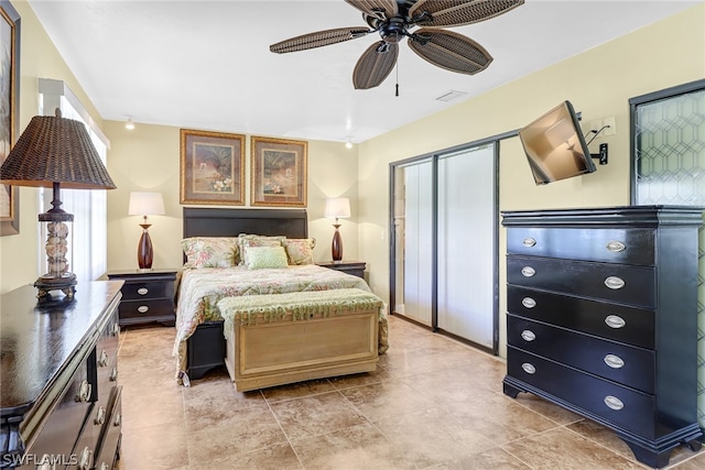 tiled bedroom with ceiling fan