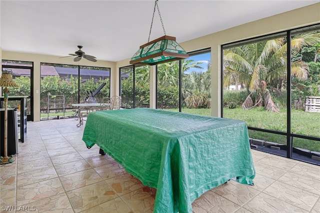 interior space featuring ceiling fan and light tile floors