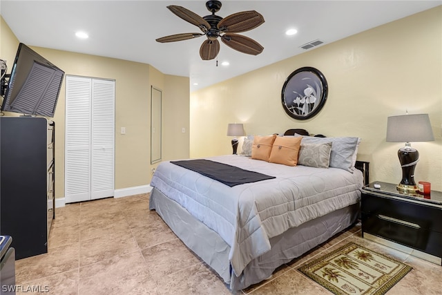 tiled bedroom featuring ceiling fan