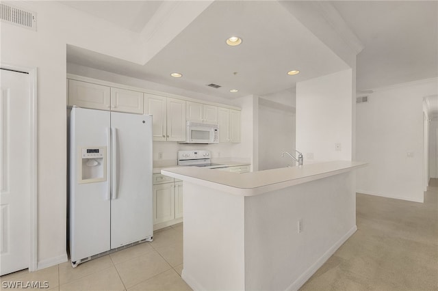 kitchen with crown molding, a center island with sink, light tile patterned floors, white appliances, and white cabinets