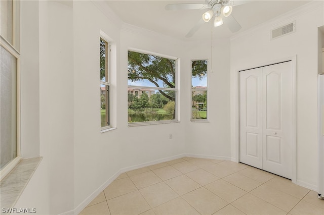 interior space featuring ornamental molding and ceiling fan