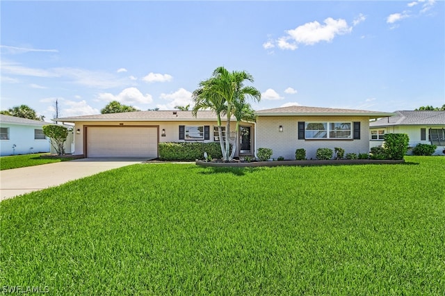 ranch-style house featuring a garage and a front yard