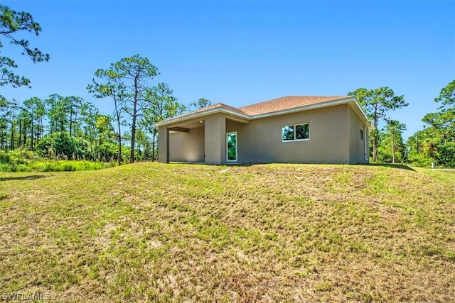 back of house with a yard