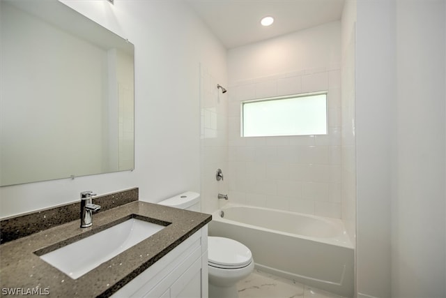 full bathroom with toilet, tiled shower / bath, and vanity