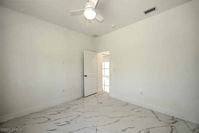 spare room featuring ceiling fan