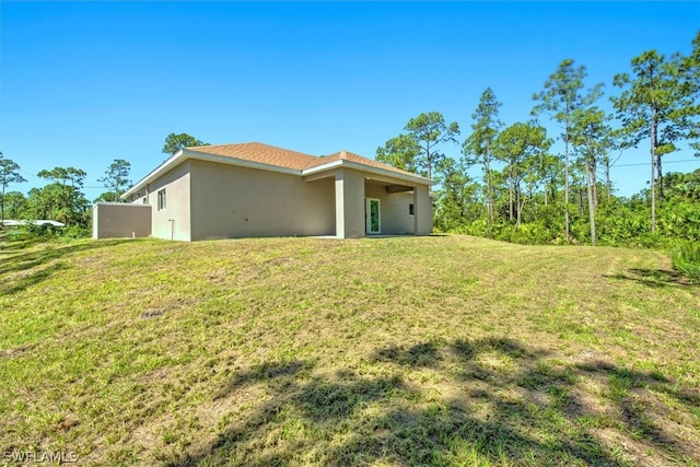 exterior space featuring a lawn