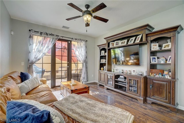 living room with ceiling fan, french doors, and dark hardwood / wood-style floors