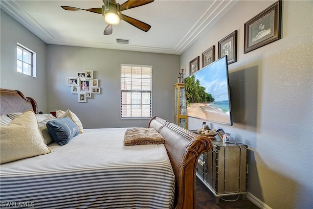 bedroom featuring ceiling fan and crown molding