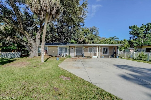 ranch-style house with a front lawn