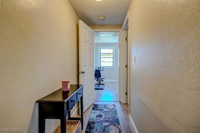 corridor featuring hardwood / wood-style flooring