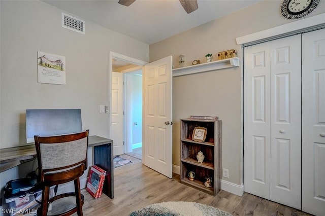 office featuring ceiling fan and light hardwood / wood-style flooring