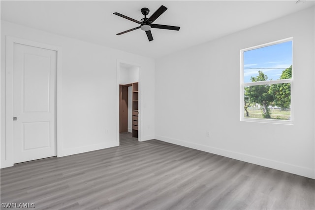 spare room with hardwood / wood-style floors and ceiling fan