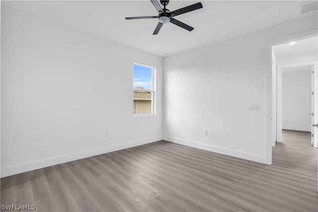 empty room featuring hardwood / wood-style flooring and ceiling fan