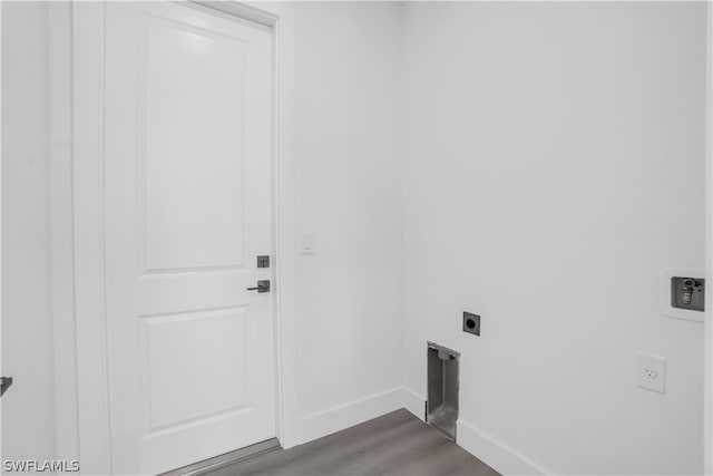 clothes washing area featuring electric dryer hookup and hardwood / wood-style floors