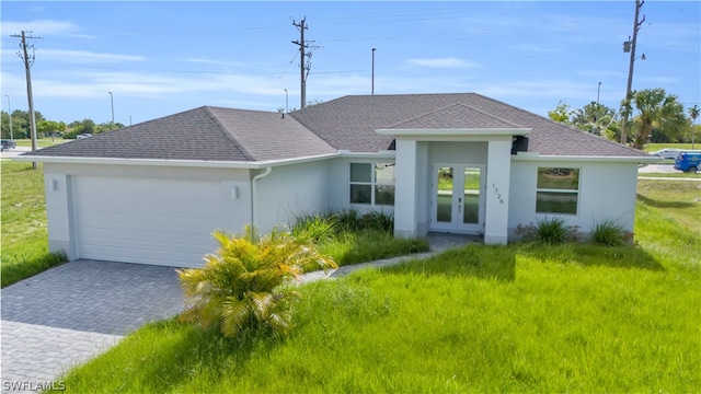 view of front of house featuring a garage and french doors