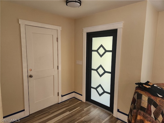 foyer with dark hardwood / wood-style floors