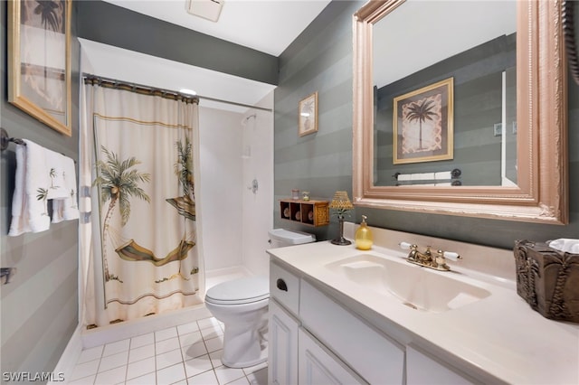 bathroom featuring tile flooring, oversized vanity, and toilet