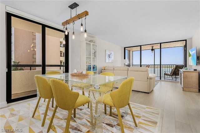 dining area with a wall of windows