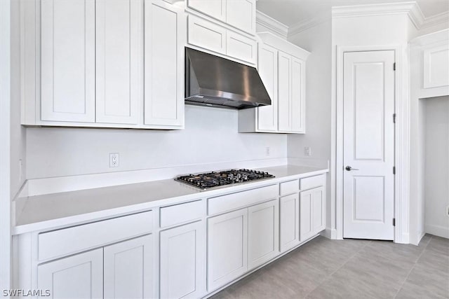 kitchen featuring stainless steel gas stovetop, ornamental molding, and white cabinets