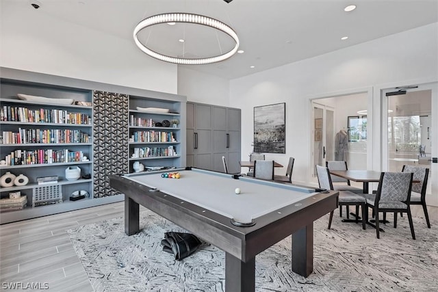 game room featuring light hardwood / wood-style floors and billiards