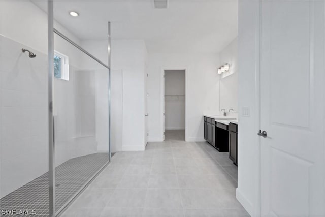 bathroom with walk in shower and vanity