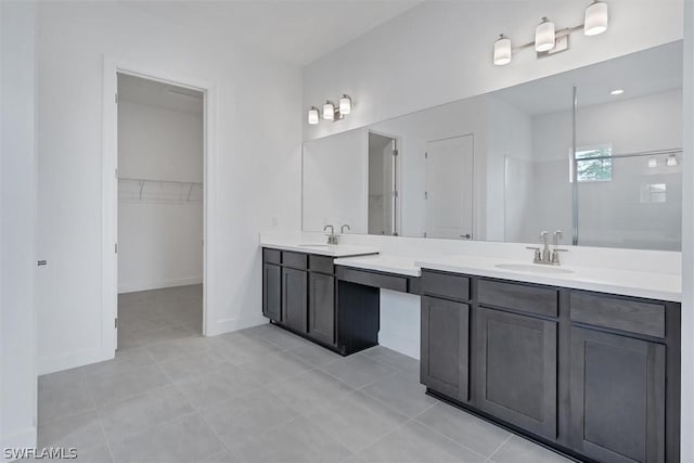 bathroom featuring a shower, tile patterned floors, and vanity