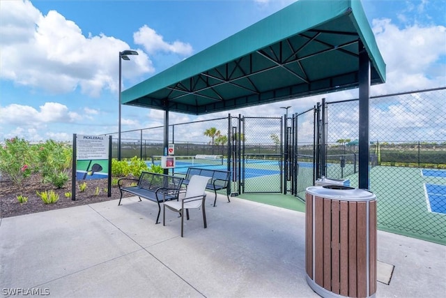 view of patio / terrace featuring tennis court