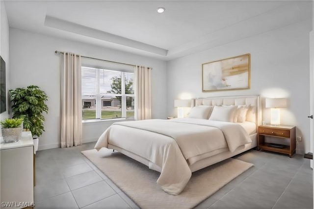 bedroom featuring a raised ceiling