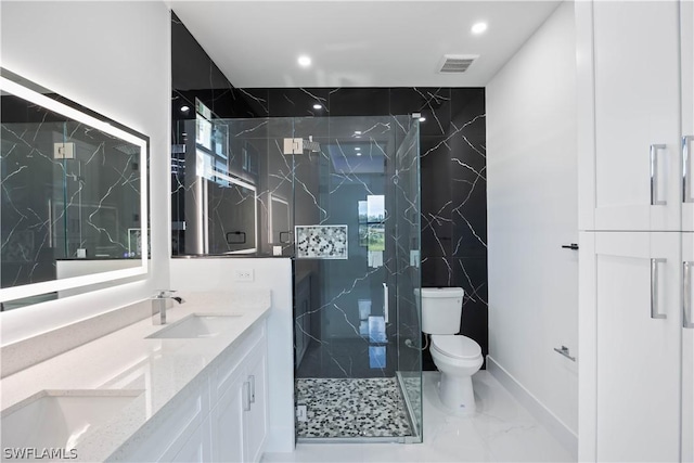 bathroom with vanity, toilet, and an enclosed shower