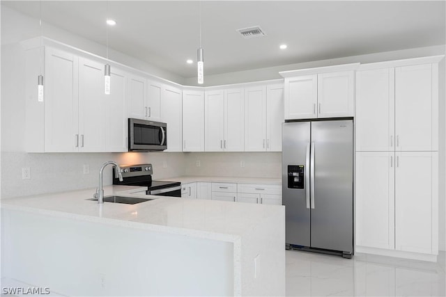 kitchen with decorative backsplash, stainless steel appliances, and white cabinetry